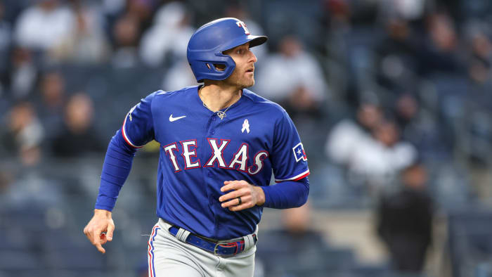 May 8, 2022; Bronx, New York, USA; Texas Rangers third baseman Brad Miller (13) looks up at his two run home run during the seventh inning against the New York Yankees at Yankee Stadium.